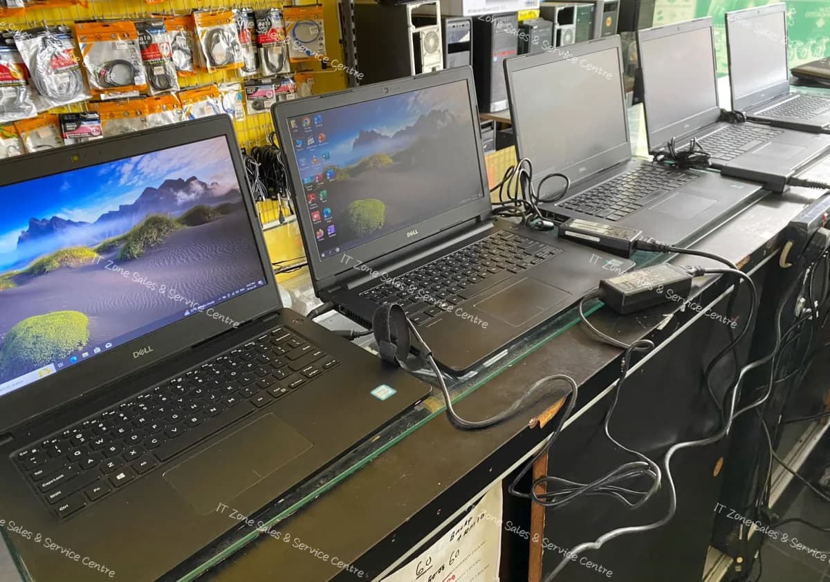 Two laptops checked side by side on the bench